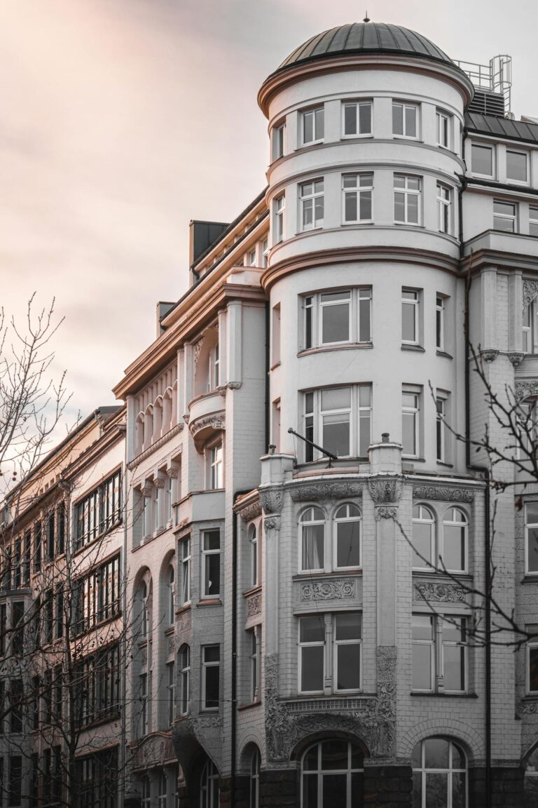 Elegant historic building in Hamburg captured at dusk, showcasing classic architecture.