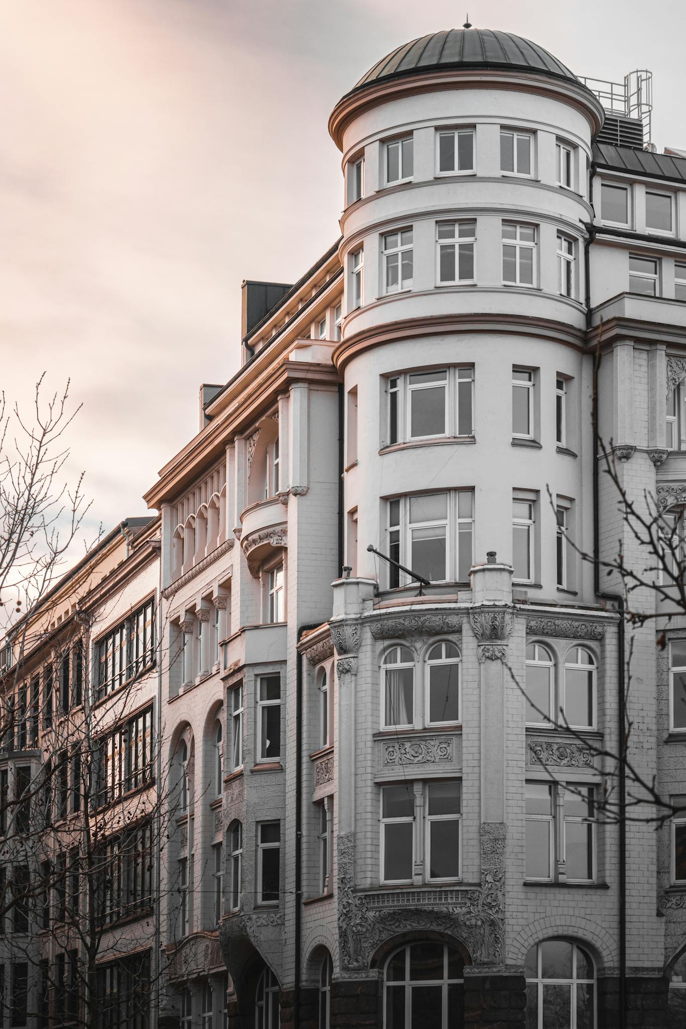 Elegant historic building in Hamburg captured at dusk, showcasing classic architecture.